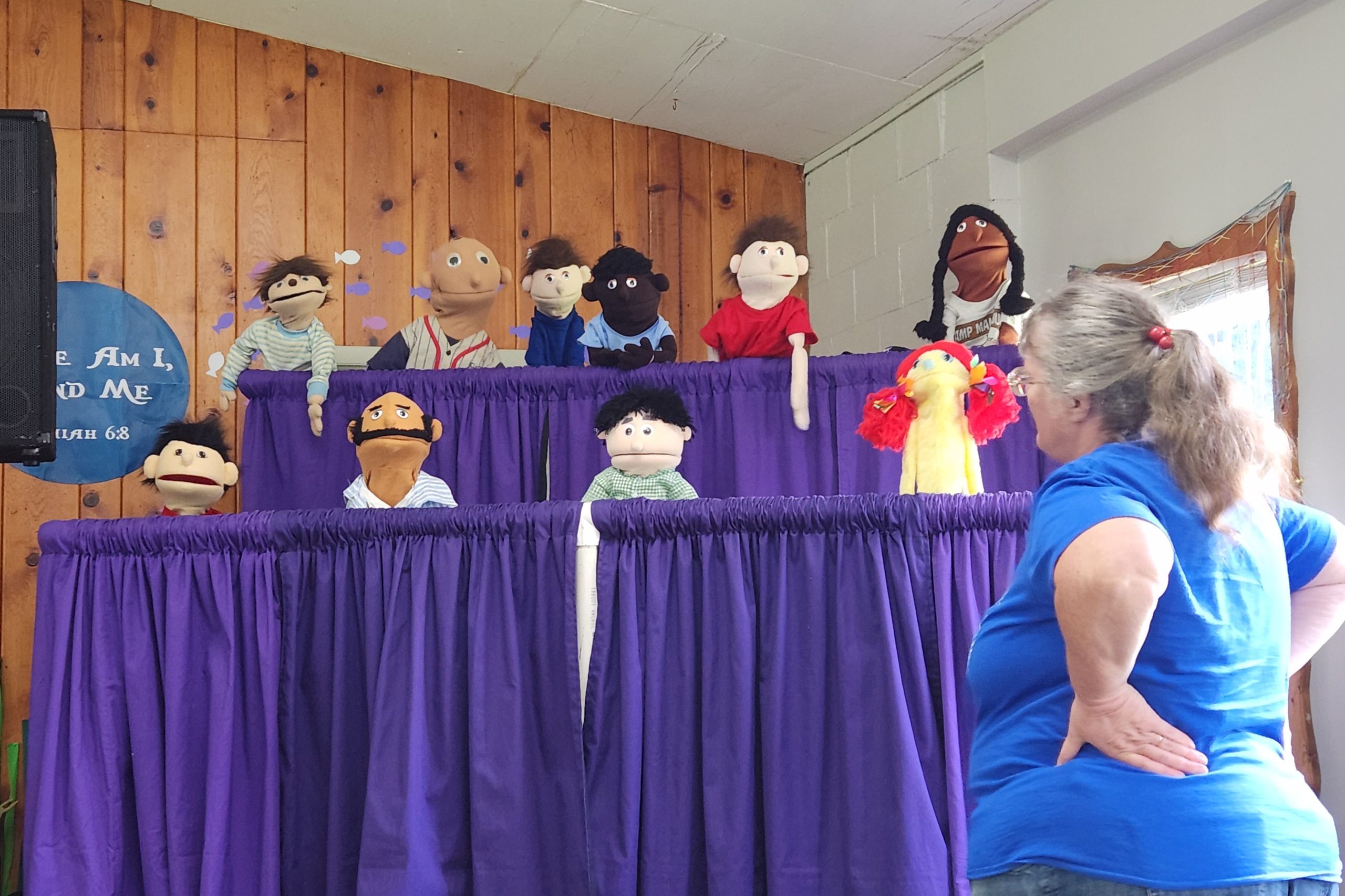 Leader evaluating student puppet performance